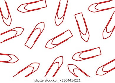 Business office pattern. A pile of red paper clips scattered on a white background