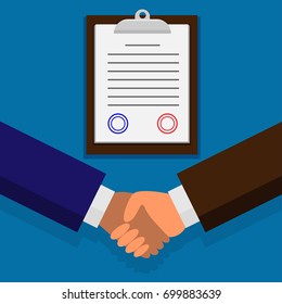 Business partners dealing a transaction by shaking hands and singing the contract