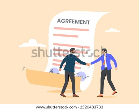 Business partners shaking hands after signing business agreement documents