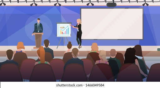 business people couple tribune speech. business people making financial presentation on conference meeting with flip chart. modern boardroom interior flat horizontal.