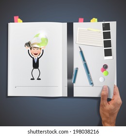 Business people holding ecologic bulb printed on book