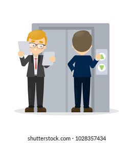 Business people near elevator at office building.