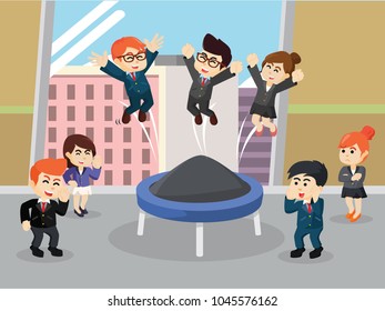 Business people playing trampoline while break time in the office