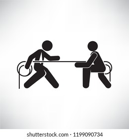 business people playing tug of war