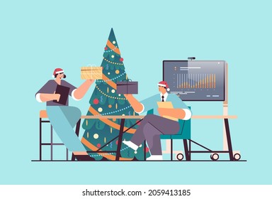 business people in santa hats holding gifts businesspeople celebrating corporate party new year christmas holidays celebration