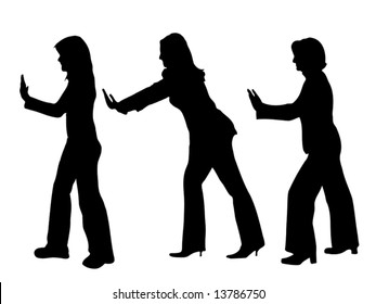 business people silhouettes pushing something up isolated over a white background