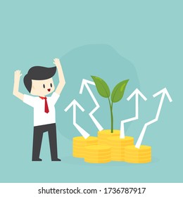Business people stand on money and green trees, representing the start of investment or start up business with investment graphs in the background.