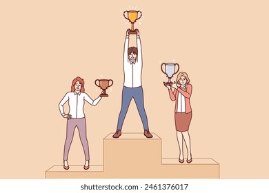 Business people stand on pedestal and hold award cups received for outstanding careers and skills. Business achievement of ambitious man who took first place and two women with secondary prizes