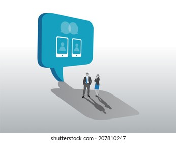 Business people standing with large speech bubble on grey background