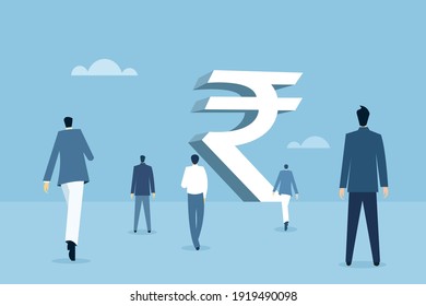 Business people walking towards a big Indian rupee structure 