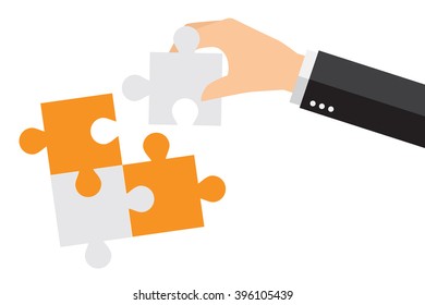 Business people are working together to put two puzzles