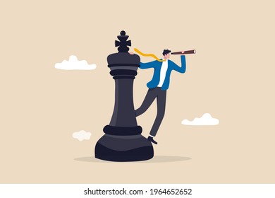 Business planning strategy, leadership vision to make decision, management or business opportunity concept, business man leader standing on king chess piece using telescope to see business vision.