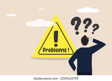 Business problems, complicated work problems, running out of ideas, business men who are facing problems at work. Male worker standing confused in front of big business trouble sign.