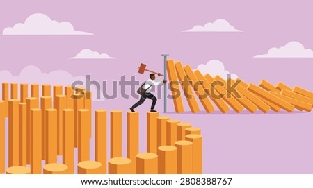 A business professional uses a large metal spike to stop a line of falling dominoes, representing crisis management, risk mitigation, and preventing chain reactions in a corporate environment.