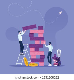Business risk concept-Two businessmen playing the tower game