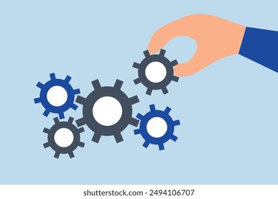 Business solution to fix problem, businessman hand put important gear to make machine run good.