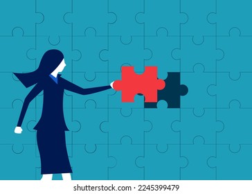 business solutions. Businesswoman completes the last puzzle. symbol of creative success