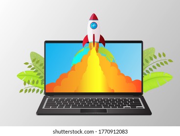 Business start up concept template with laptop and rocket flying out of the desktop screen.