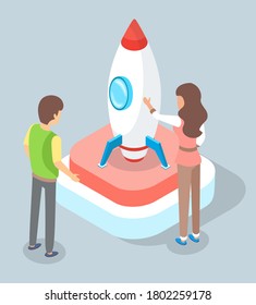 Business startup concept. Businesswoman and buisnessman standing at the rocket as a symbol of successful entrepreneurship, innovation and technology. Teamwork project development. Meeting of engineers