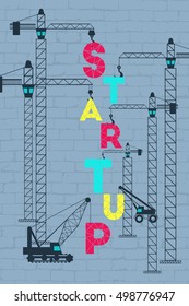 Business startup concept. Construction site working on lifting the startup wording.