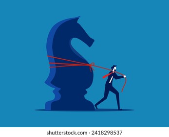 Business strategy. Businessman dragging big knight chess 