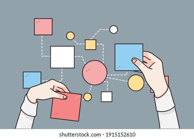 Business strategy, planing, processes concept. Hands of businessman changing papers business steps for making one strategy for development over grey table background, top view 