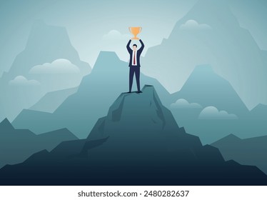 Business success, winning competition. Businessman standing on top of mountain, arm raised with a trophy.