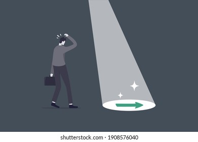 Business support or mentor help discover right direction, leadership to see business vision or career path concept, spotlight shining light on floor reveal arrow guidance to businessman in the dark.