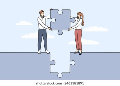 Business team working together jobs to build solid project and holding puzzle piece in hands. Happy man and woman doing team work to achieve common goal and launch successful startup.