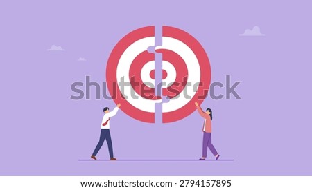 Business teamwork concept. Business people combine two pieces of the big target puzzle together.