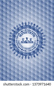business teamwork icon inside blue badge with geometric pattern.