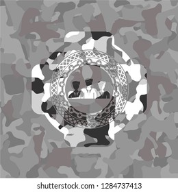 business teamwork icon inside grey camouflaged emblem