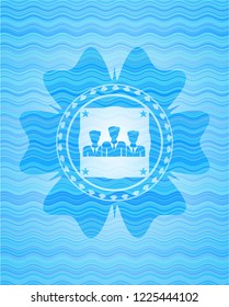 business teamwork icon inside water representation badge.