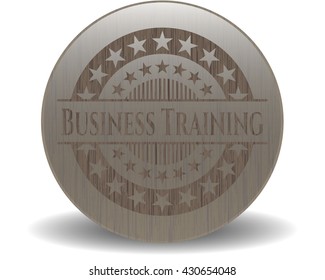 Business Training badge with wooden background