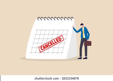 Business trip cancelled, marketing event, plan to launch new product postpone or cancelled due to COVID-19 Coronavirus pandemic concept, sad businessman standing with calendar with red Cancelled stamp