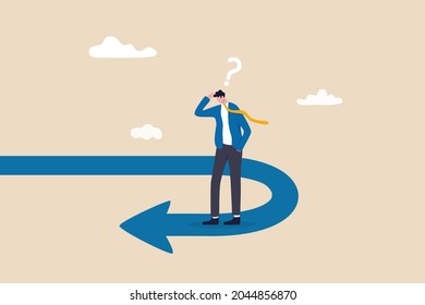 Business turning point, break event or change direction, reverse back, interest rate or financial trend change concept, frustrated businessman investor looking at his reverse direction pathway.