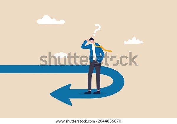 Business turning point, break event or change\
direction, reverse back, interest rate or financial trend change\
concept, frustrated businessman investor looking at his reverse\
direction pathway.