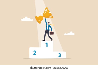 Business winning first place, success or victory, award winner or achievement, champion trophy or career success concept, proud businessman holding winner trophy on first place podium with spotlight.