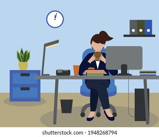 Business woman eating a hamburger lunch at her office desk