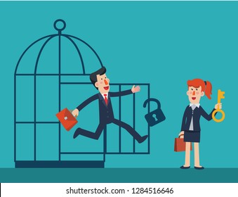 Business woman freeing business man from a cage 