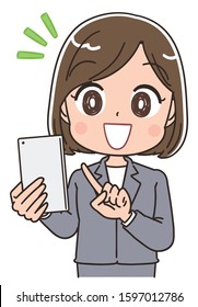 A business woman in a gray suit.She has a smartphone in her hand.