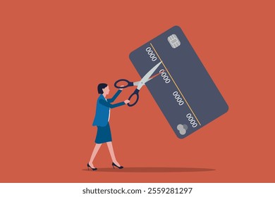 Business woman holding scissors and cutting credit card