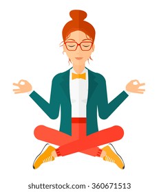 Business woman meditating in lotus pose.