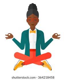 Business woman meditating in lotus pose.