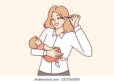 Business woman mother holds baby in arms and does makeup at same time, keeping balance between family and career. Successful woman holding newborn son and getting ready to go to work