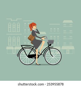 Business woman on a bicycle talking on the phone