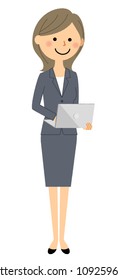 Business woman operating a laptop computer