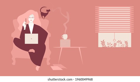 Business woman, sitting comfortably with her laptop, working at home in the company of a cat and coffee