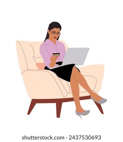 Business woman sitting on armchair with laptop.