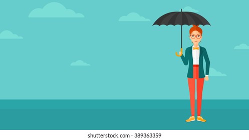 Business woman standing with umbrella.